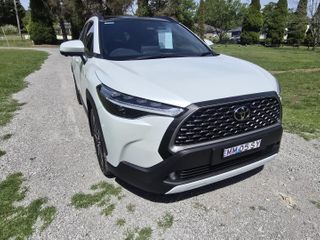 2024  Toyota Corolla Cross Atmos SUV (Frosted White) Used Car Thumbnail